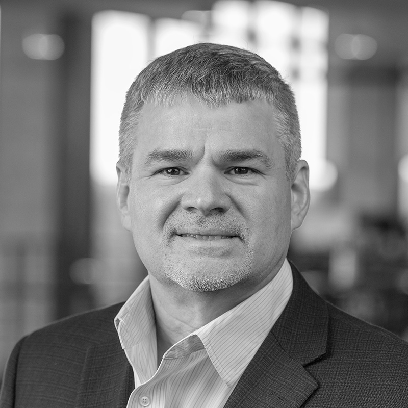 Black and white portrait photo of OneTrust CFO, Doug Owens